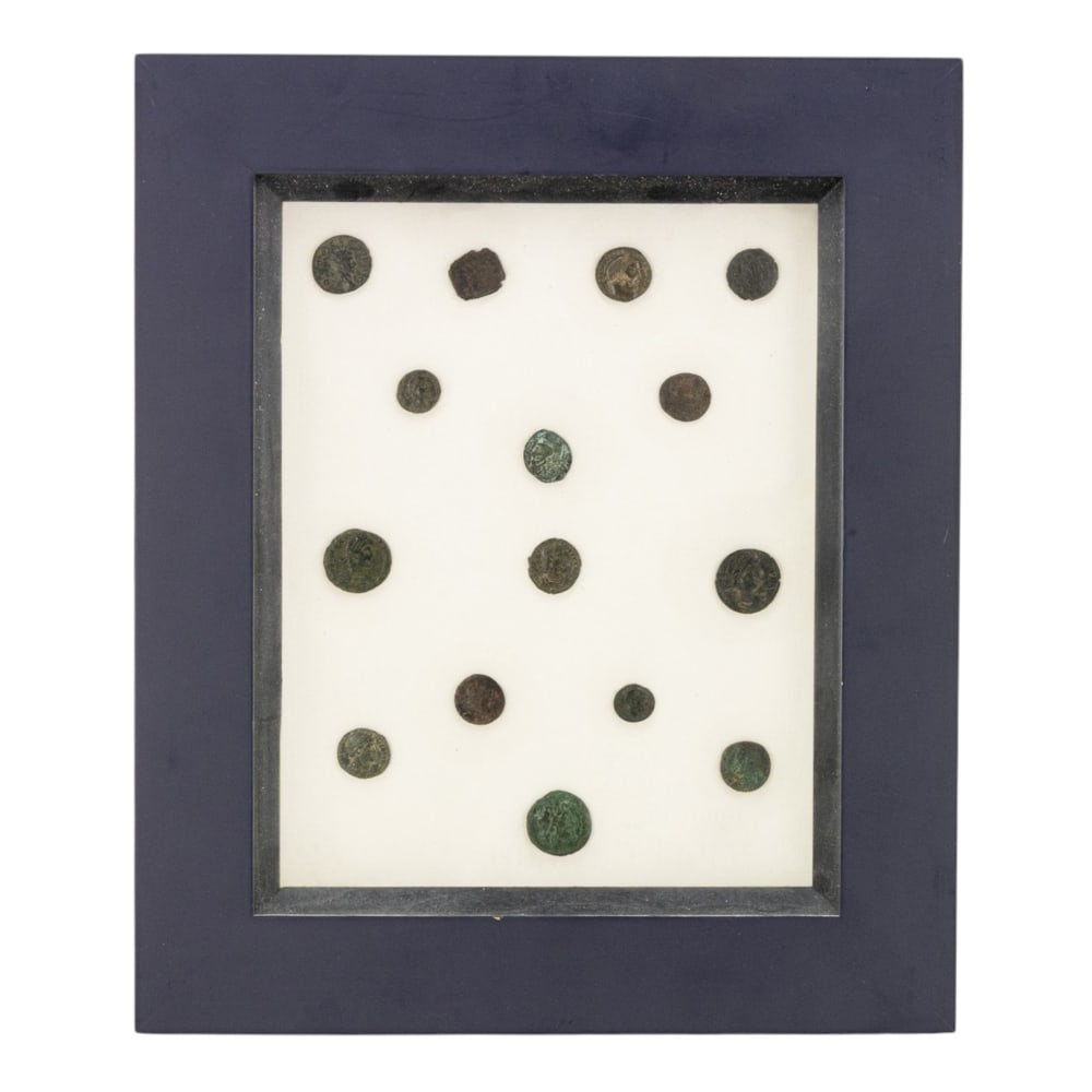 A collection of fifteen Roman coins of various denominations and dates: A collection of fifteen Roman coins of various denominations and dates, now mounted in frame, framed 12.5"h x 10.35"dia