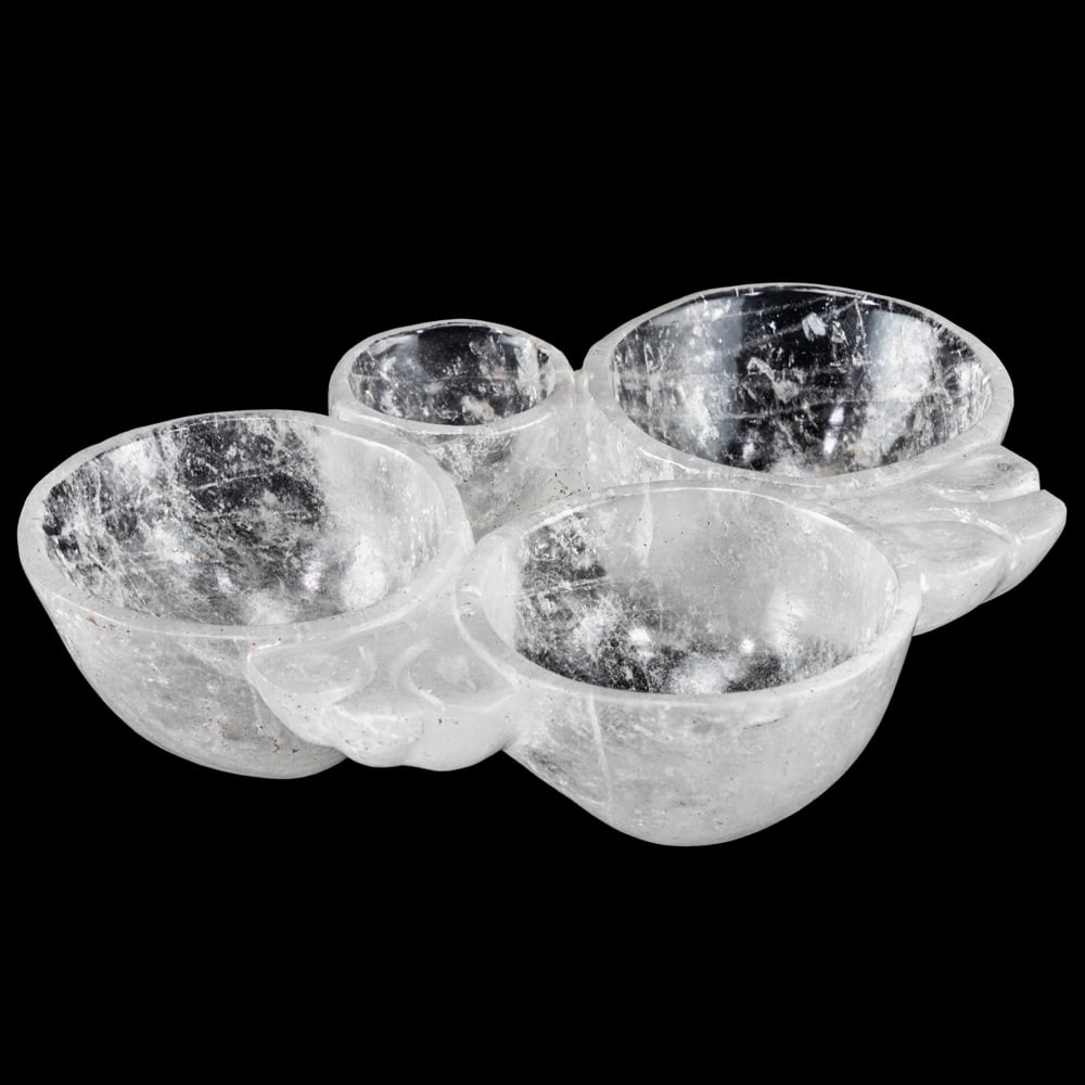 A rock crystal bowl: A rock crystal bowl, carved with four sections from a single block, 2"h x 7"w x 5.5"