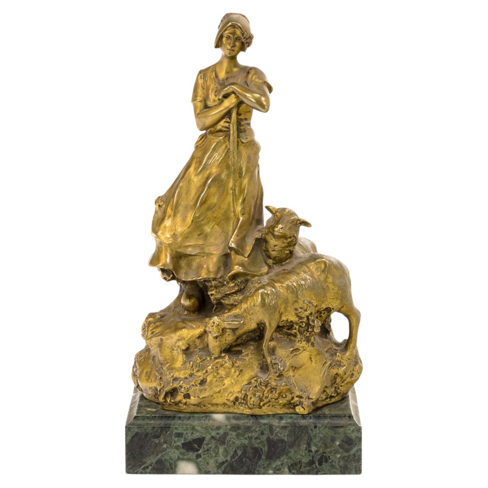 A Continental gilt bronze figural spill vase, Charles Korschann: A Continental gilt bronze figural spill vase, Charles Korschann (1872-1943), Louchet Foundry, Paris, early 20th century, modeled as a shepherdess accompanied by two sheep, incised 'Korschann', impress