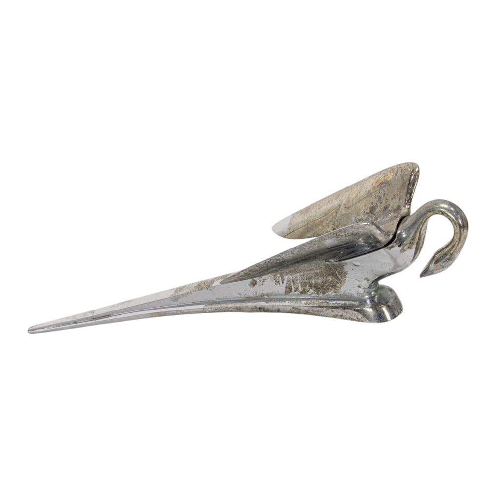 A chromed metal 'Cormorant' swan hood ornament: A chromed metal 'Cormorant' swan hood ornament, 1951-1954 Packard, numbered '151310', 28.5"l
