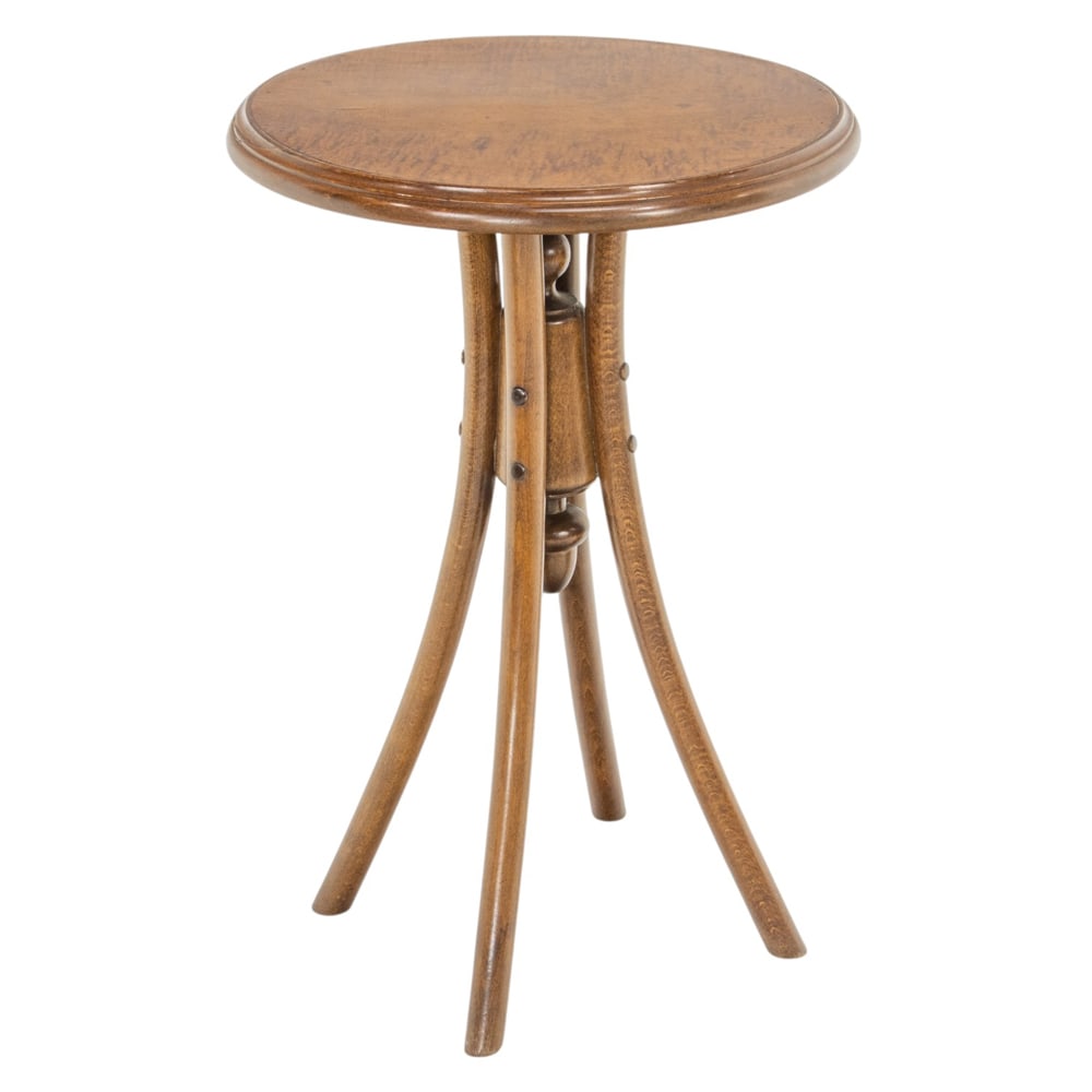 A bentwood occasional table: A bentwood occasional table, having a circular top resting on bentwood legs conjoined by the turned support, 30"h x 20"dia. Property of a private collection, Presidio Heights, San Francisco