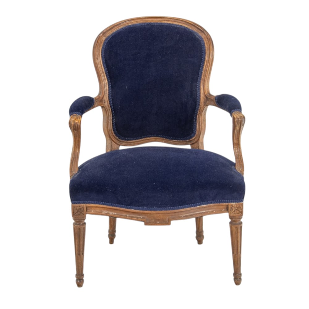 A French velvet upholstered armchair: A French velvet upholstered armchair, 33.5"h x 23.5"w x 24"d; 17"h x 18.5"d (seat). Property of a private collection, Presidio Heights, San Francisco