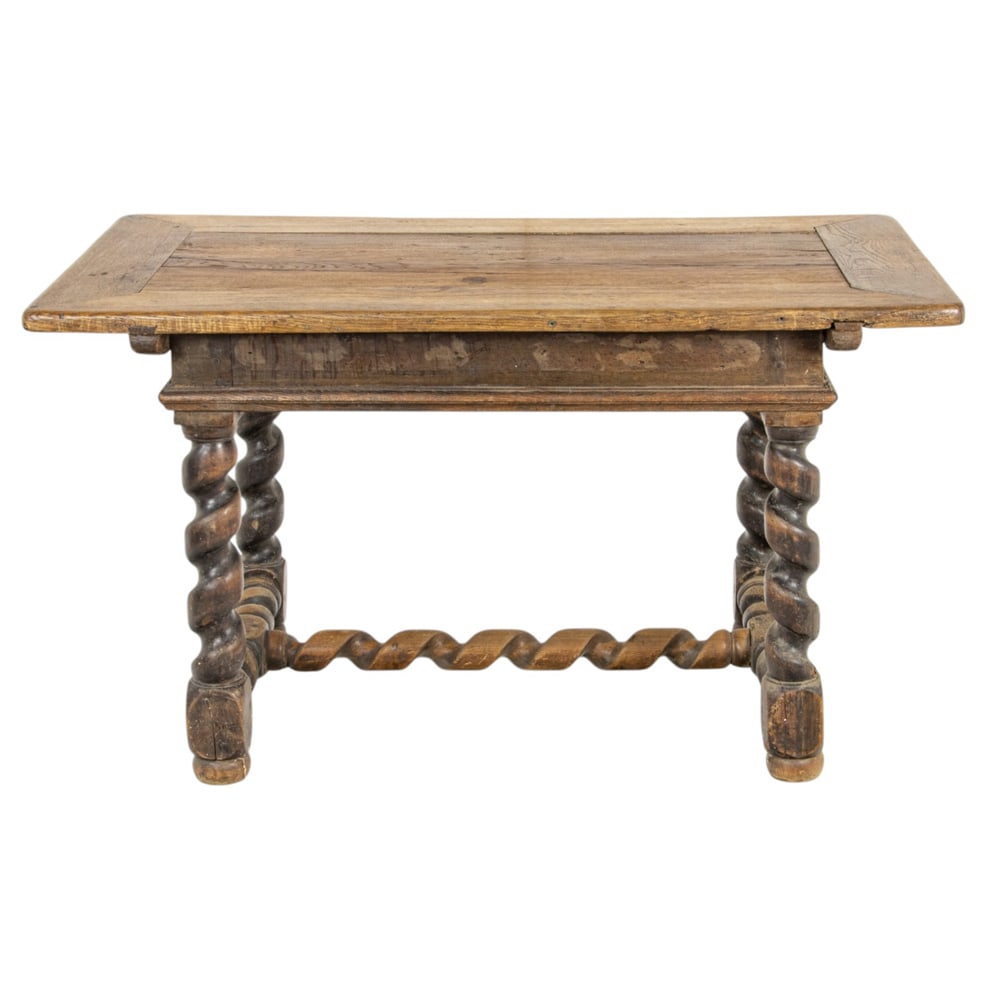 A French Louis XIV table late 17th/18th century and later: A French Louis XIV table late 17th/18th century and later, the rectangular top resting on the large barley twist supports conjoined by the box stretcher, and rising on compressed bun feet, 30"h x