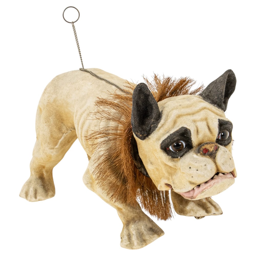 A French papier-mache growler bulldog: A French papier-mache growler bulldog, late 19th century, featuring flocked coat, glass eyes, straw fringe collar, includes chain mechanism that when pulled nods head, opens hinged mouth and