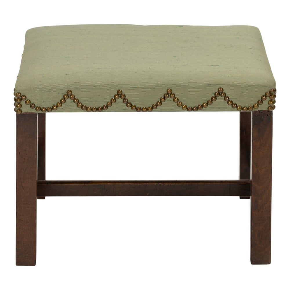 An upholstered stool with brass nailhead design: An upholstered stool with brass nailhead design, 16"h x 21"w x 18"d. Property of a private collection, Presidio Heights, San Francisco