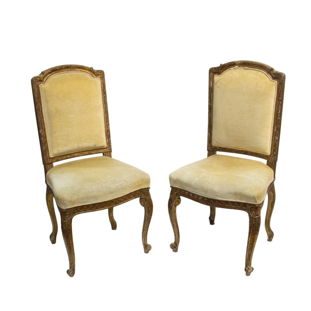 A pair of fine French giltwood side chairs first half 19th century: A pair of fine French giltwood side chairs first half 19th century, each with a carved high back above the serpentine seat, the seat rail with repeating wave detail, and rising on acanthus carved