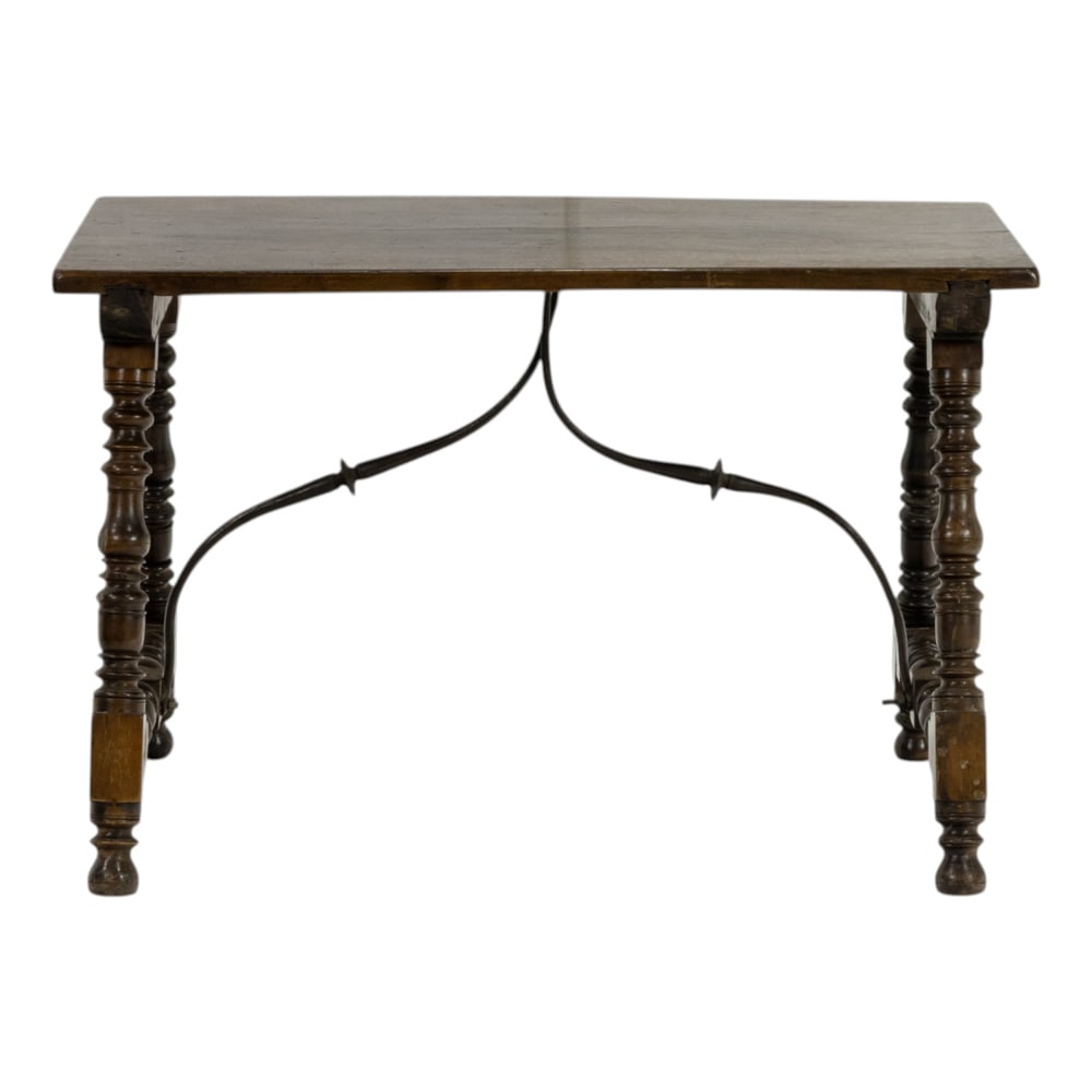 A Spanish Baroque table 18th century: A Spanish Baroque table 18th century, having a block and turned trestle base with iron supports, 26"h x 40.5"w x 20.5"d. Property of a private collection, Presidio Heights, San Francisco