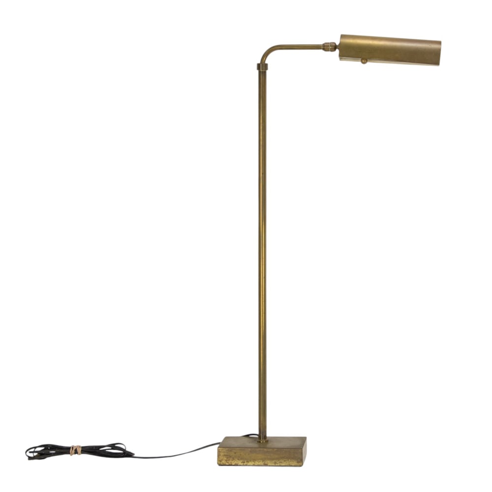 A brass adjustable reading lamp: A brass adjustable reading lamp, adjustable between 37"h and 61.5"h. Property of a private collection, Presidio Heights, San Francisco