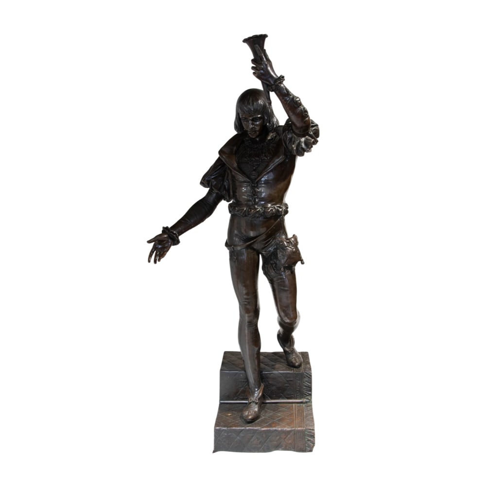 A large Continental style patinated bronze figural torchiere of a troubadour: A large Continental style patinated bronze figural torchiere of a troubadour, the youth in Renaissance costume holding aloft a torch and stepping down carpet-lined stairs, 73.5"h; 18.5"w x 24"d (base)