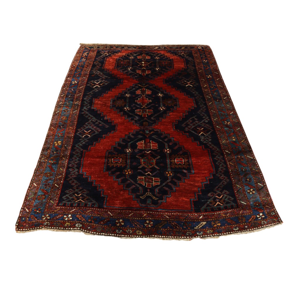 A Persian carpet: A Persian carpet, 8'8" x 5'11"