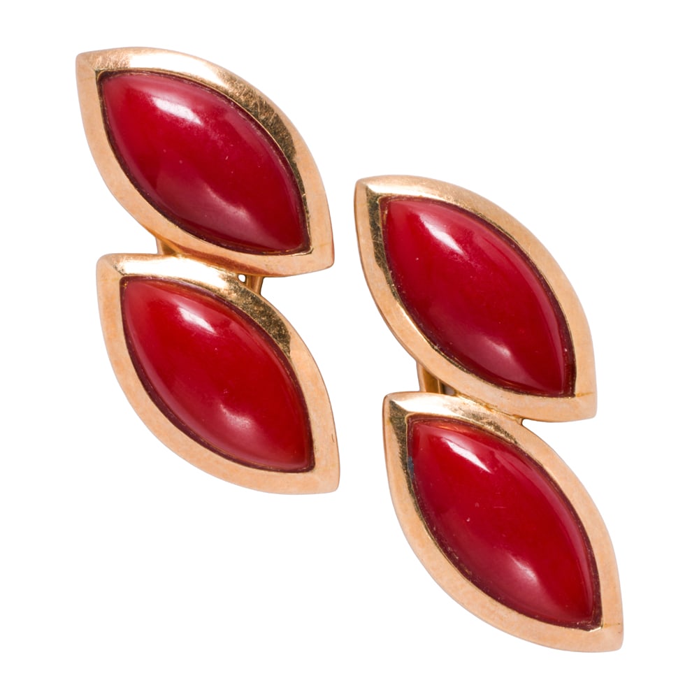 A pair of coral and 14k gold ear clips: A pair of coral and 14k gold ear clips Featuring two marquise-shaped coral cabochons measuring 15.61 mm long; length: 1 1/8 in; 8.35 grams