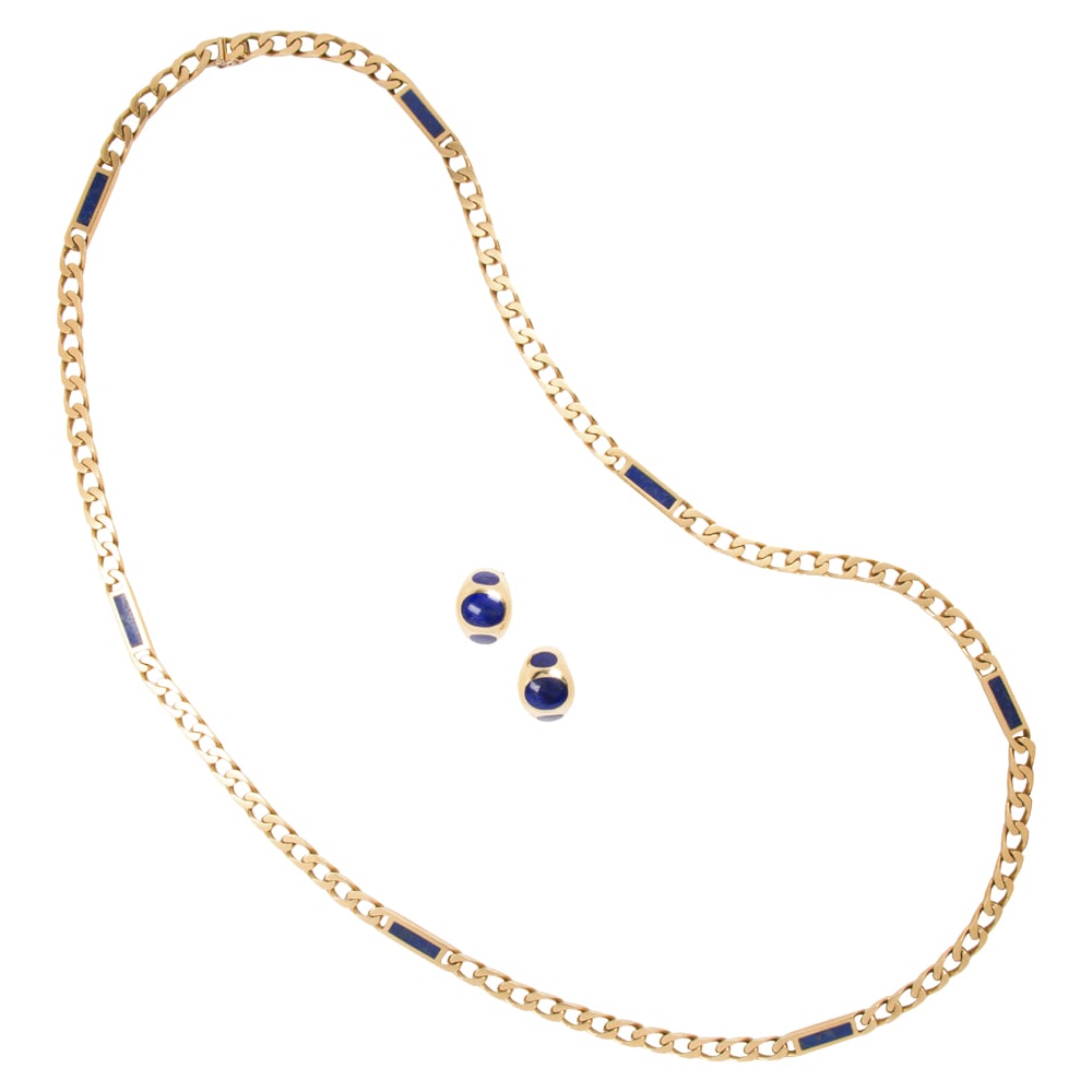 A lapis lazuli and 18k gold chain and ear-clip set: A lapis lazuli and 18k gold chain and ear-clip set The curb-link chain featuring rectangular spacers set with lapis lazuli tablets measuring 16.67 x 4.43 mm, together with a pair of ear-clips set with