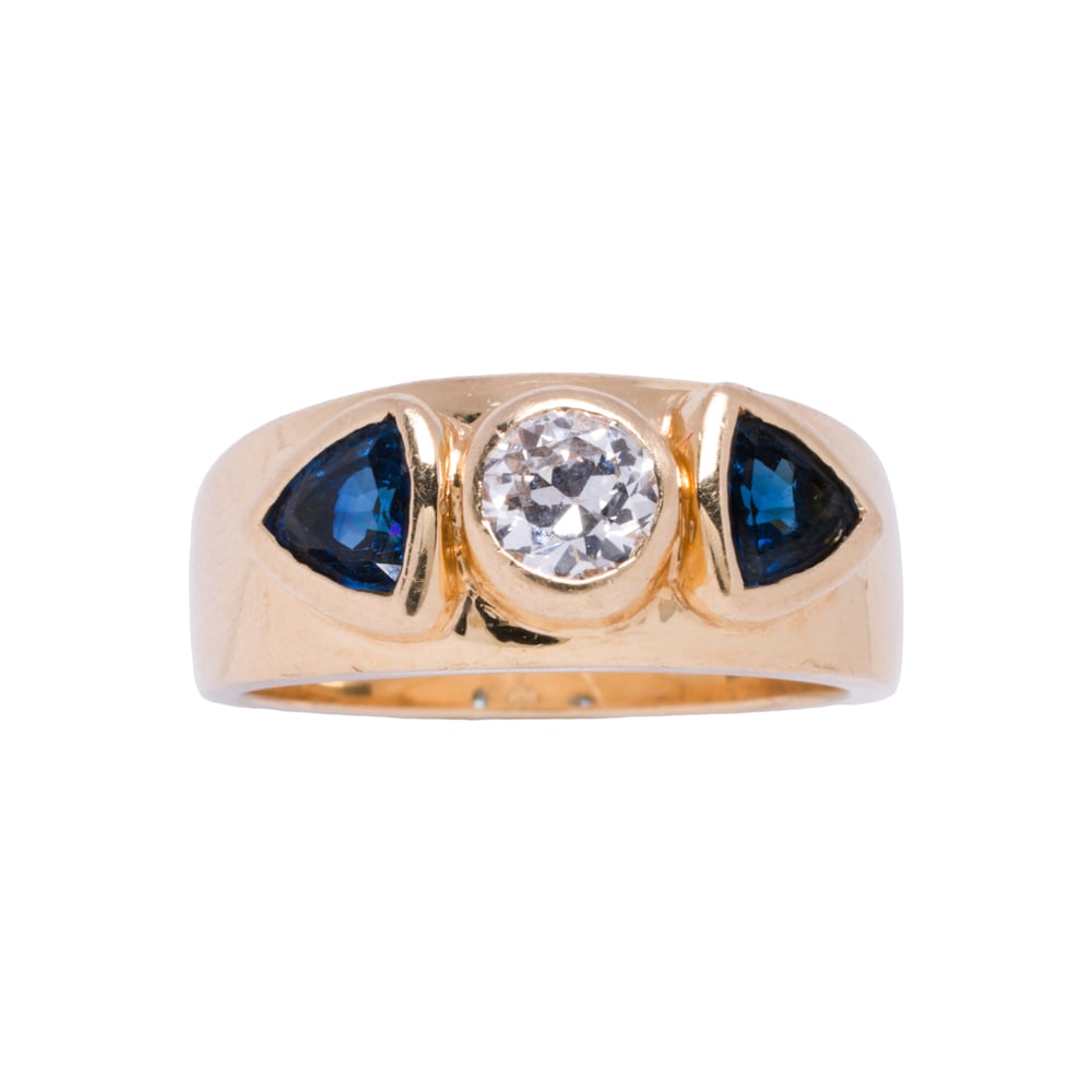 A diamond, sapphire, and 18k gold ring: A diamond, sapphire, and 18k gold ring Centering a round brilliant-cut diamond weighing approximately 0.40 carat, framed on either side by one trillion-cut sapphire; estimated total sapphire weight: