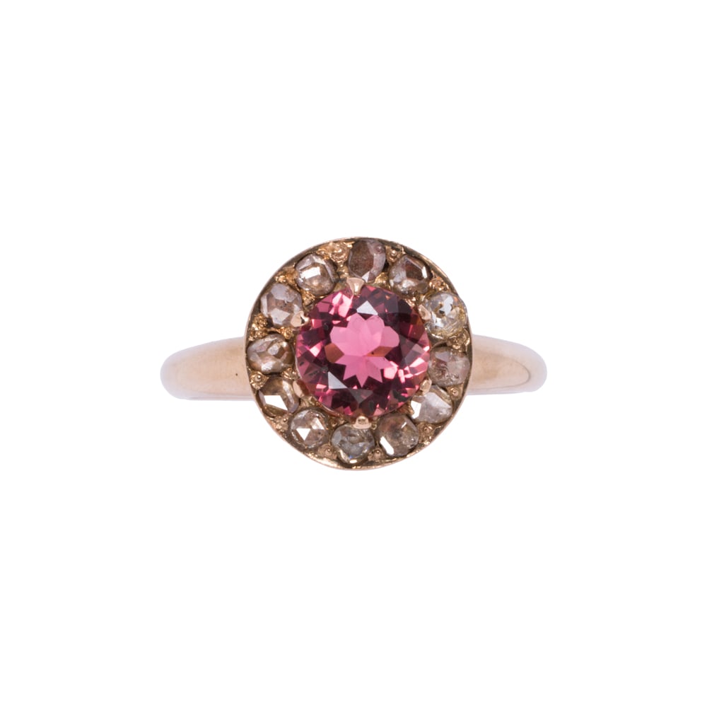 An antique style tourmaline, diamond, and 14k gold ring: An antique style tourmaline, diamond, and 14k gold ring Centering a round-cut tourmaline measuring 6.14 mm across, with rose-cut diamond surround; size 5 3/4; 2.50 grams