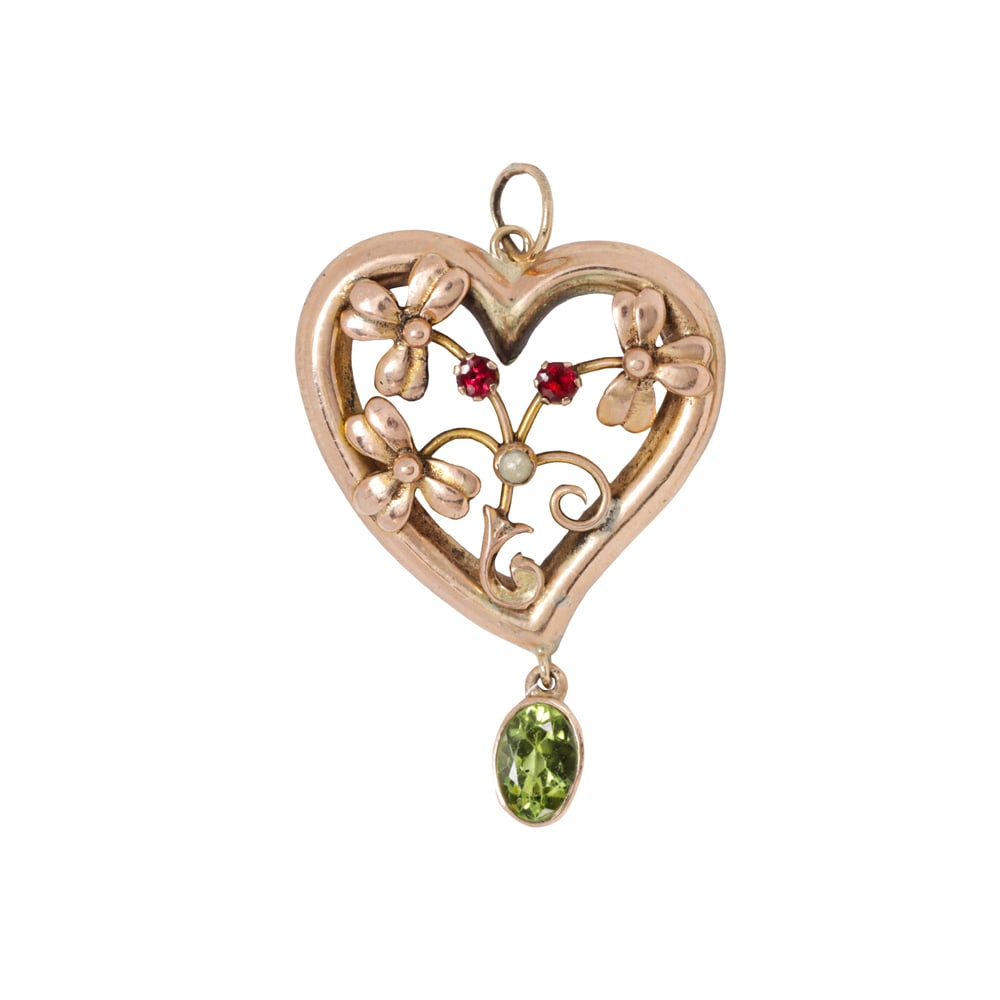 A Harrop & Neill antique garnet, seed pearl, and 9k rose gold clover pendant: A Harrop & Neill antique garnet, seed pearl, and 9k rose gold clover pendant Designed as three clovers within a heart frame, accented by two round-cut garnets, one seed pearl, and one oval-cut garnet