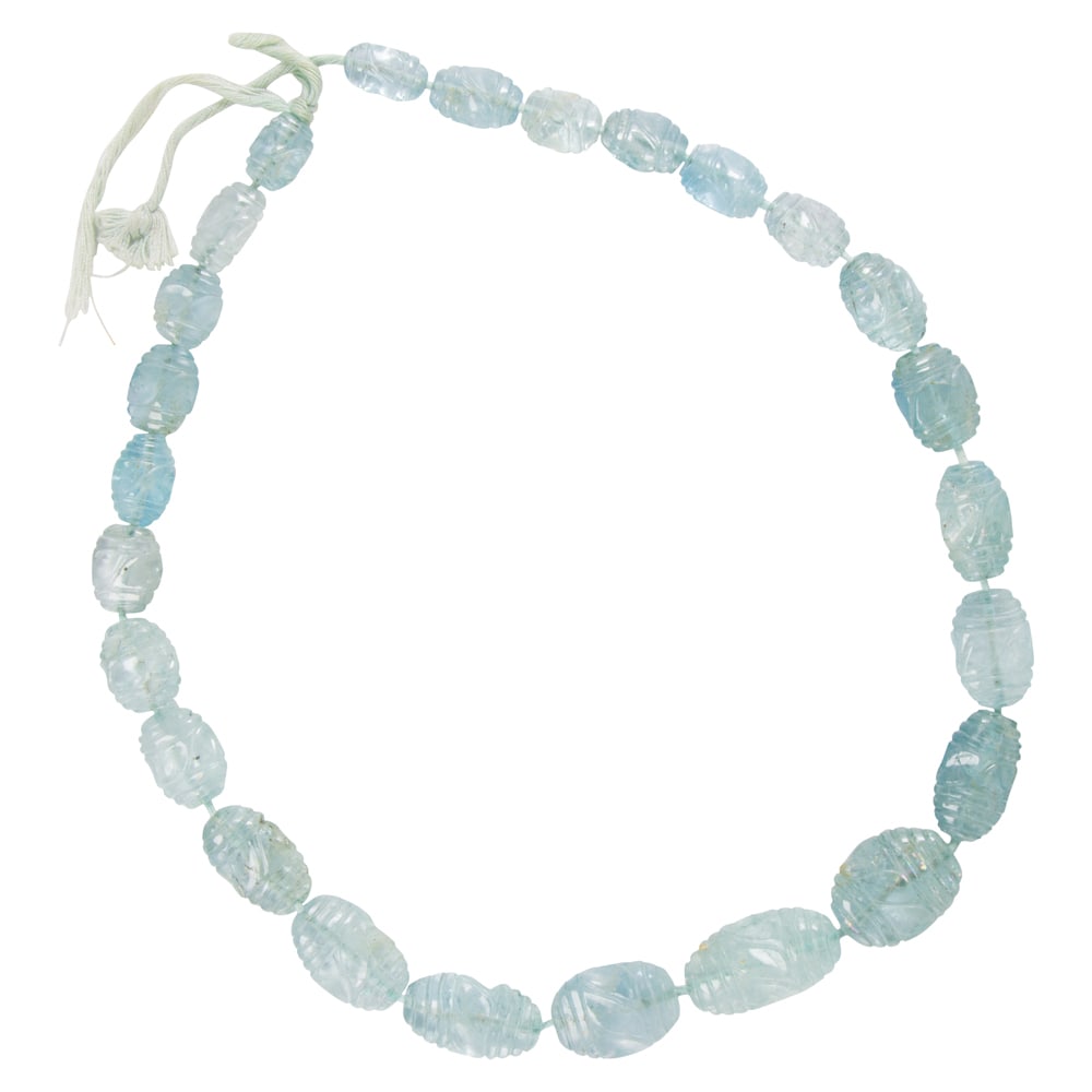 An aquamarine beaded necklace: An aquamarine beaded necklace Featuring 25 carved aquamarine beads ranging from 14.17 to 26.40 mm long; length: 21 in; 69.45 grams