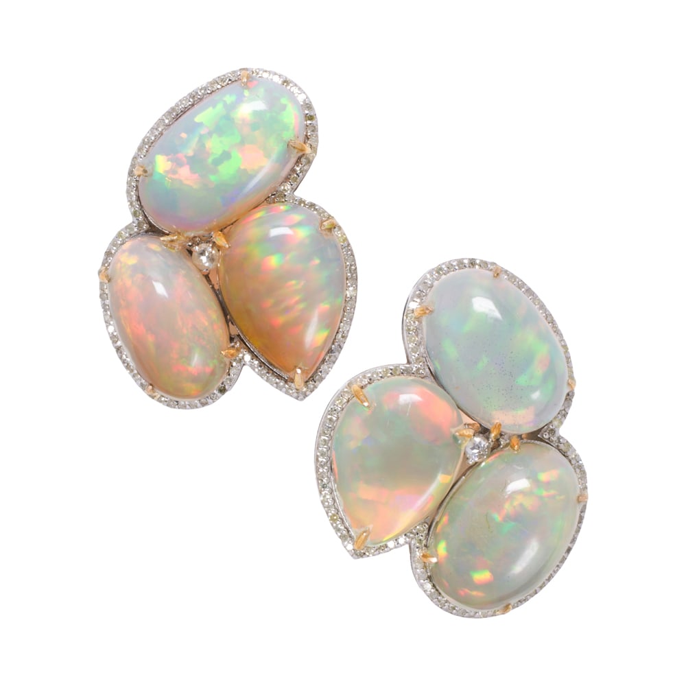 A pair of opal, diamond, silver, and 14k gold earrings: A pair of opal, diamond, silver, and 14k gold earrings The silver earrings set with oval and pear-shaped opal cabochons weighing a total of 27.20 carats, framed by round-cut diamonds, with 14k gold