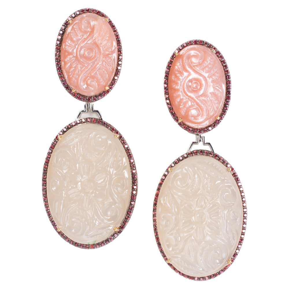 A pair of moonstone, sapphire, silver, and 14k gold earrings: A pair of moonstone, sapphire, silver, and 14k gold earrings The silver earrings featuring two carved moonstones, framed by round-cut sapphires with 14k gold prongs and backings; length: 2 1/2 in;