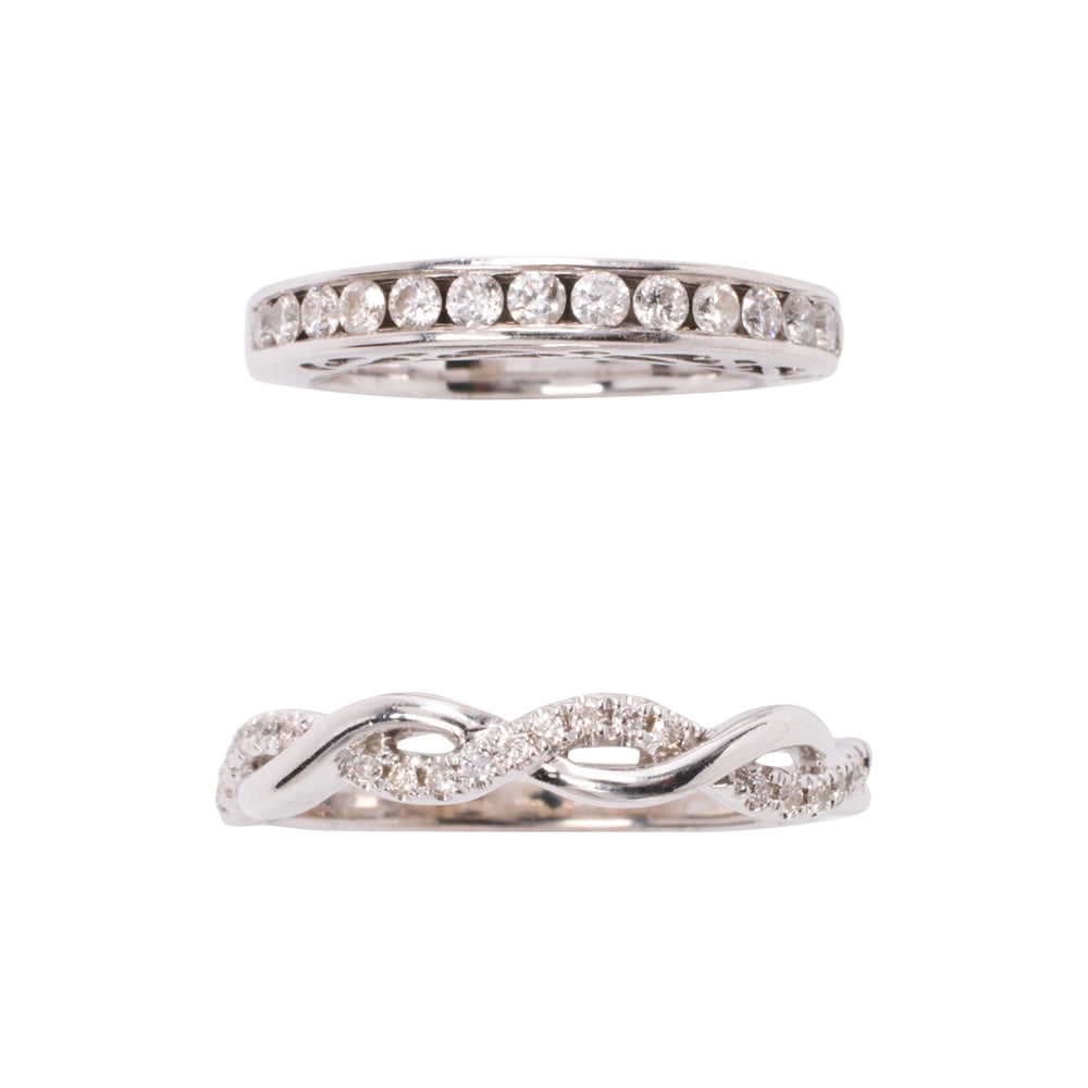 A pair of diamond and 14k white gold rings: A pair of diamond and 14k white gold rings comprising two diamond band each set with round brilliant-cut diamonds; estimated total diamond weight: 0.50 carat; sizes: 4 1/4 and 8 1/2; gross weight: