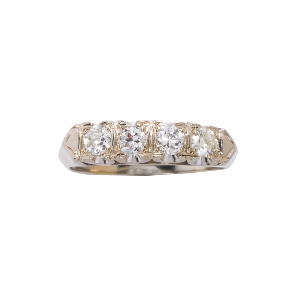 A diamond and 14k white gold band: A diamond and 14k white gold band Set with four transitional-cut diamonds weighing a total of approximately 0.80 carat; size 9 1/2; 3.35 grams