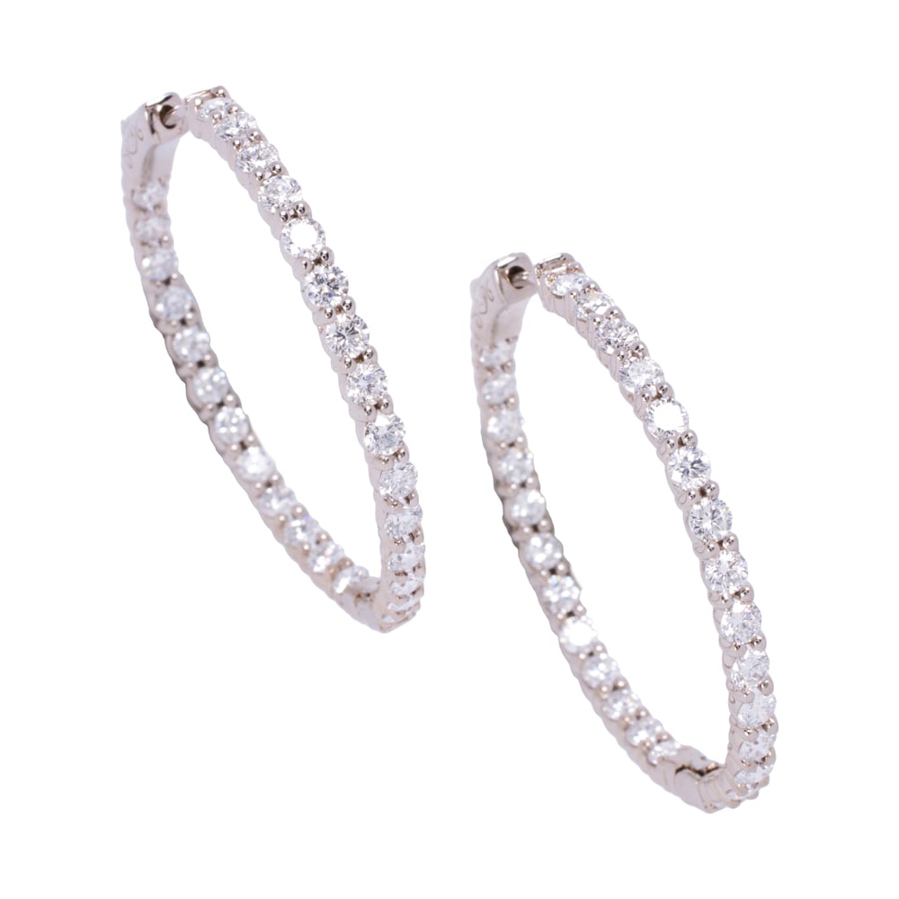 A pair of lab grown diamond and 14k white gold earrings: A pair of lab grown diamond and 14k white gold earrings Of inside-outside hoop design, set with 27 round brilliant-cut, lab grown diamonds weighing a total of 3.44 carats; length: 1 3/8 in; 7.85 grams