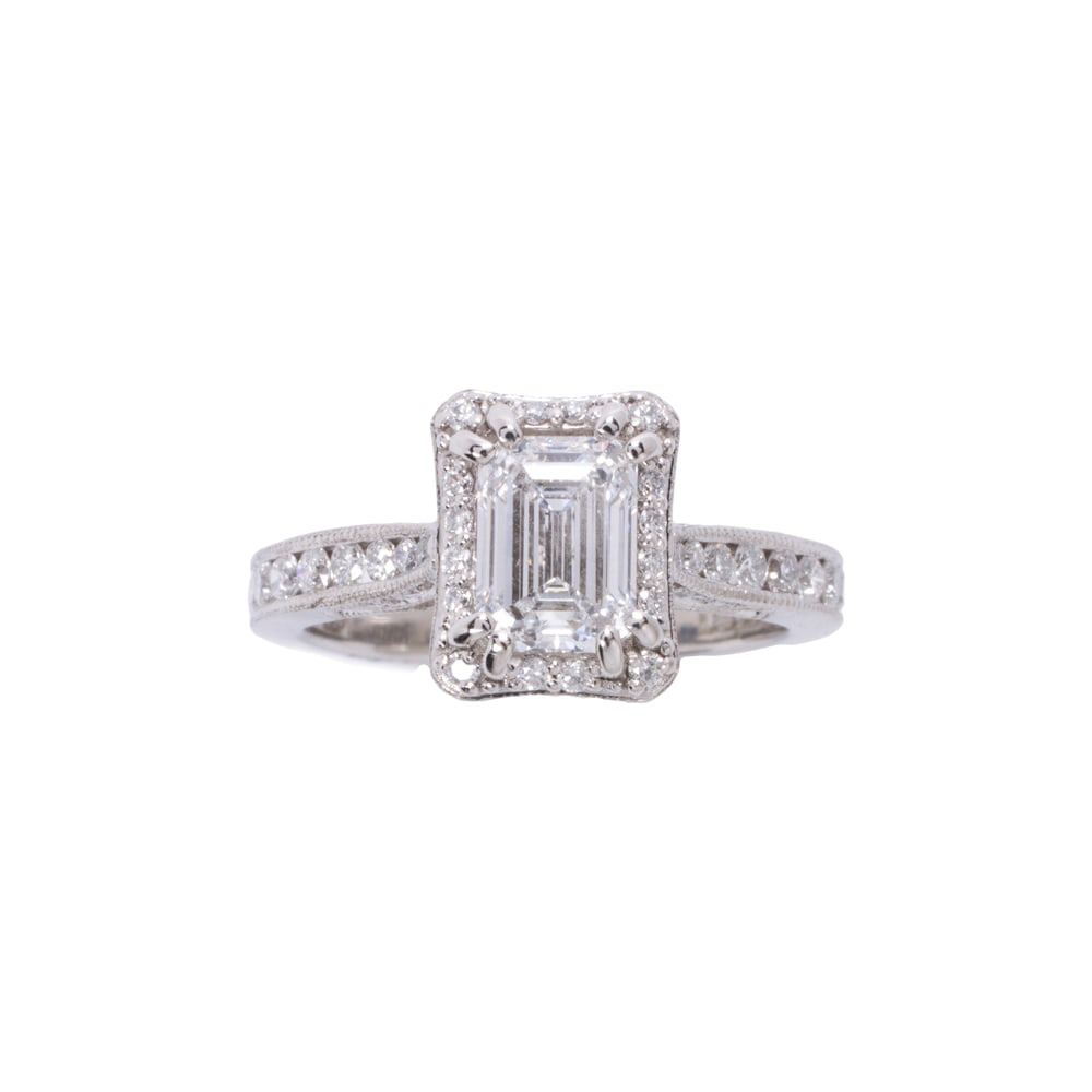 A lab grown diamond and platinum ring: A lab grown diamond and platinum ring Centering an emerald-cut laboratory grown diamond weighing 1.06 carats, framed by round brilliant-cut diamonds weighing 0.35 carat total; size 5; 5.70 grams