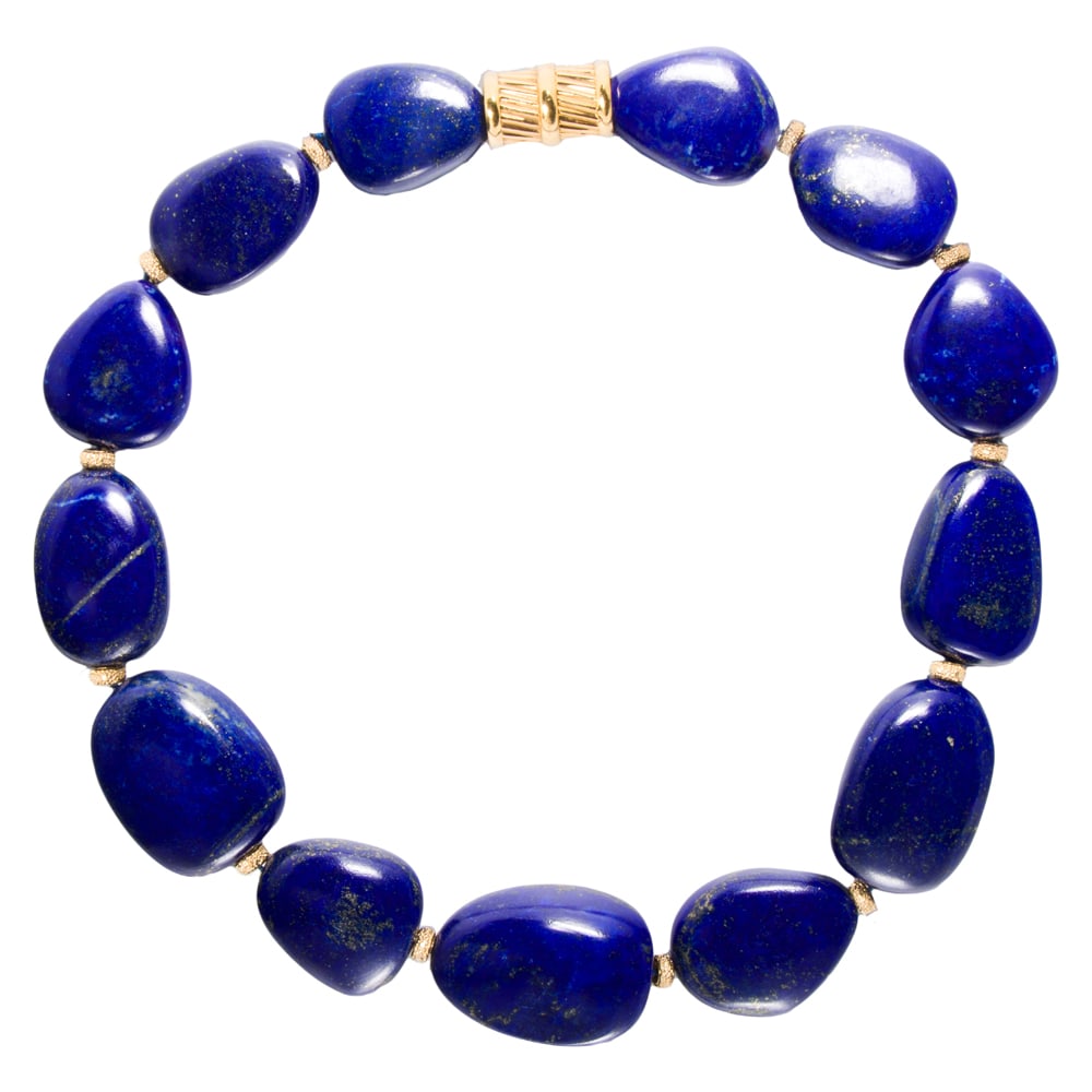 A retailed by Gump's lapis lazuli and 18k gold necklace: A retailed by Gump's lapis lazuli and 18k gold necklace Set with 13 polished lapis lazuli stones, interspersed by textured 18k gold beads; length: 18 in; 237.15 grams; accompanied by Gumps