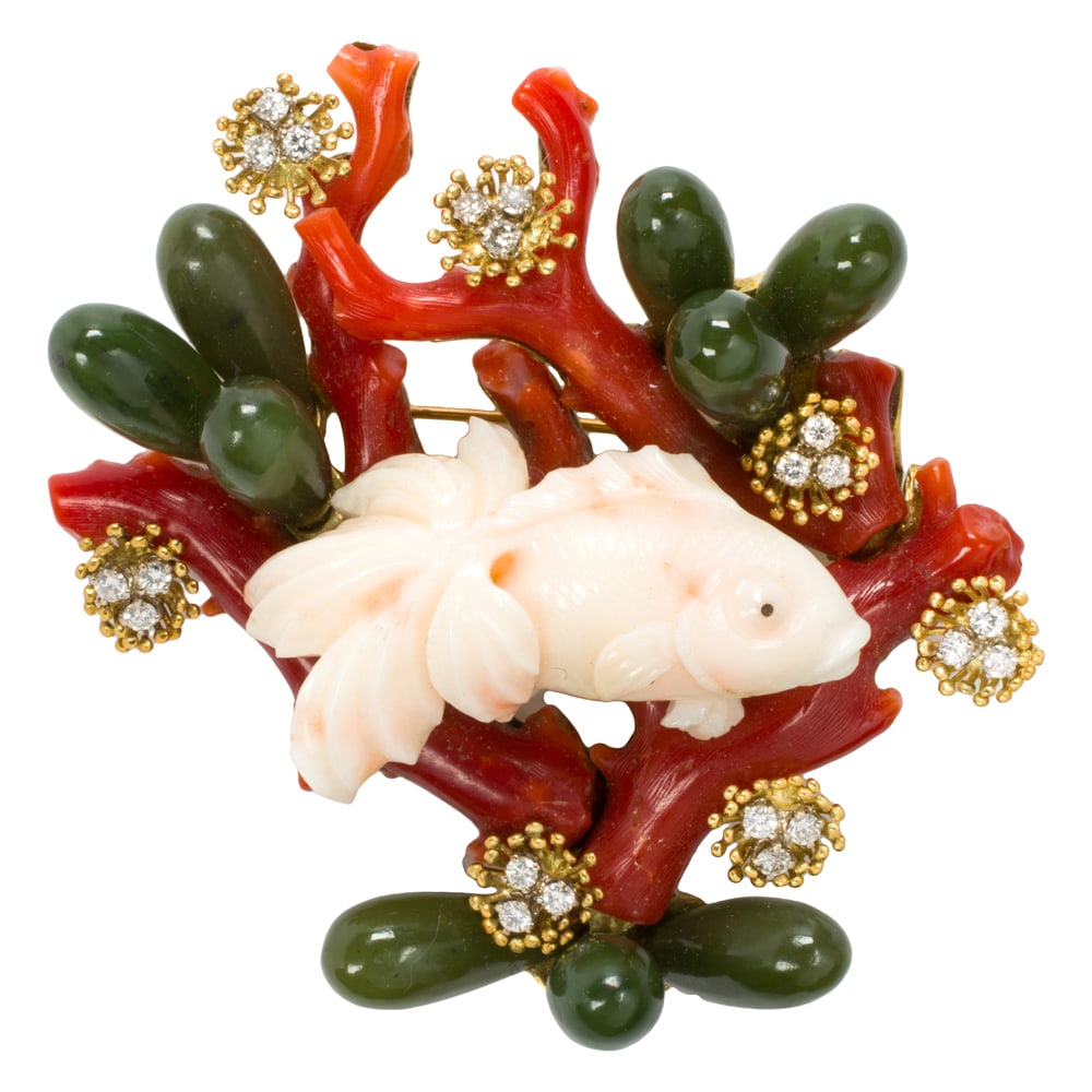 A Boris Le Beau coral, diamond, jade, and 18k gold brooch: A Boris Le Beau coral, diamond, jade, and 18k gold brooch Featuring an underwater scene centering a carved coral goldfish superimposed onto raw coral branches, accented by baskets of three round