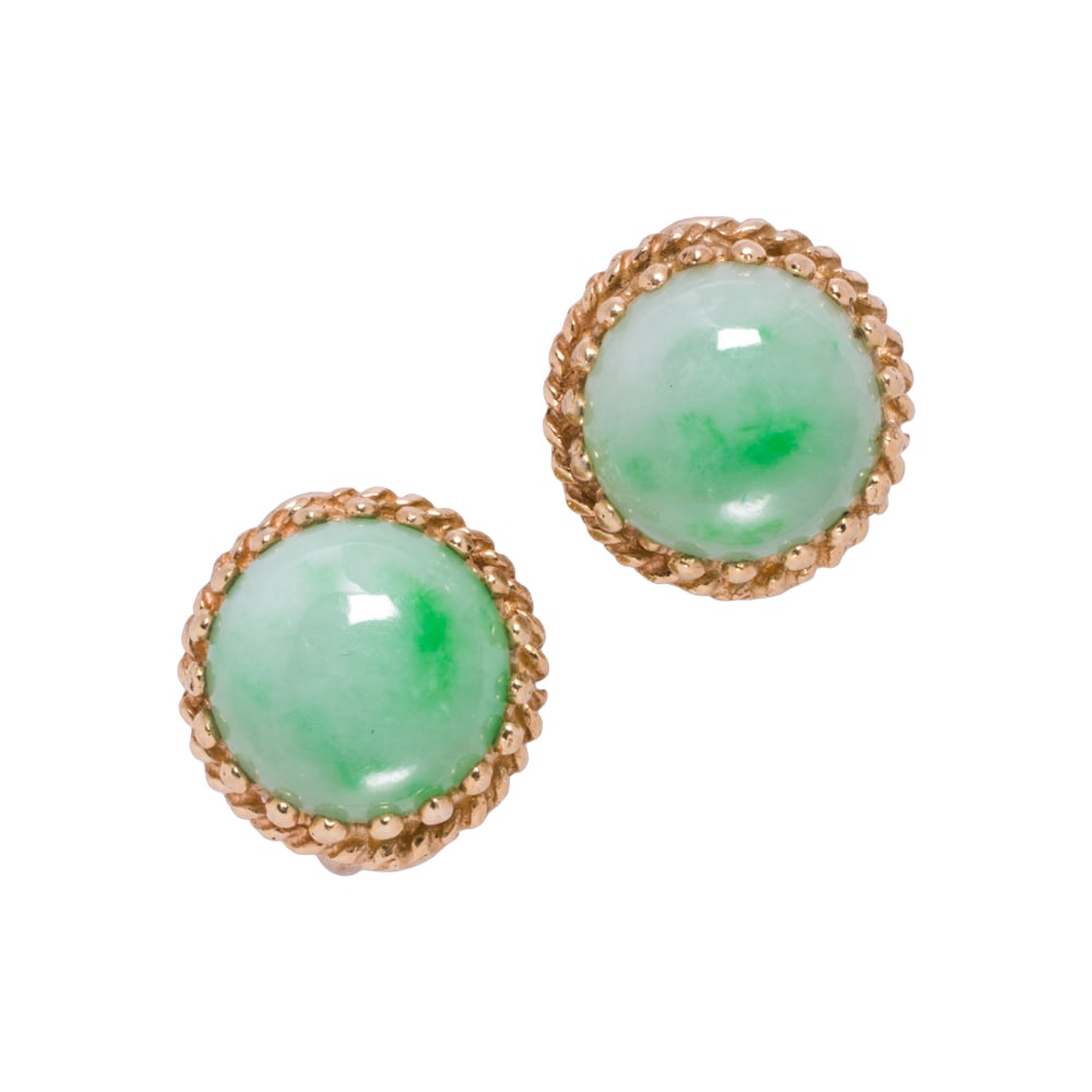 A pair of jade and 14k gold ear-clips: A pair of jade and 14k gold ear-clips Set with round-shaped jade cabochons measuring 10.82 mm across; 5.00 grams