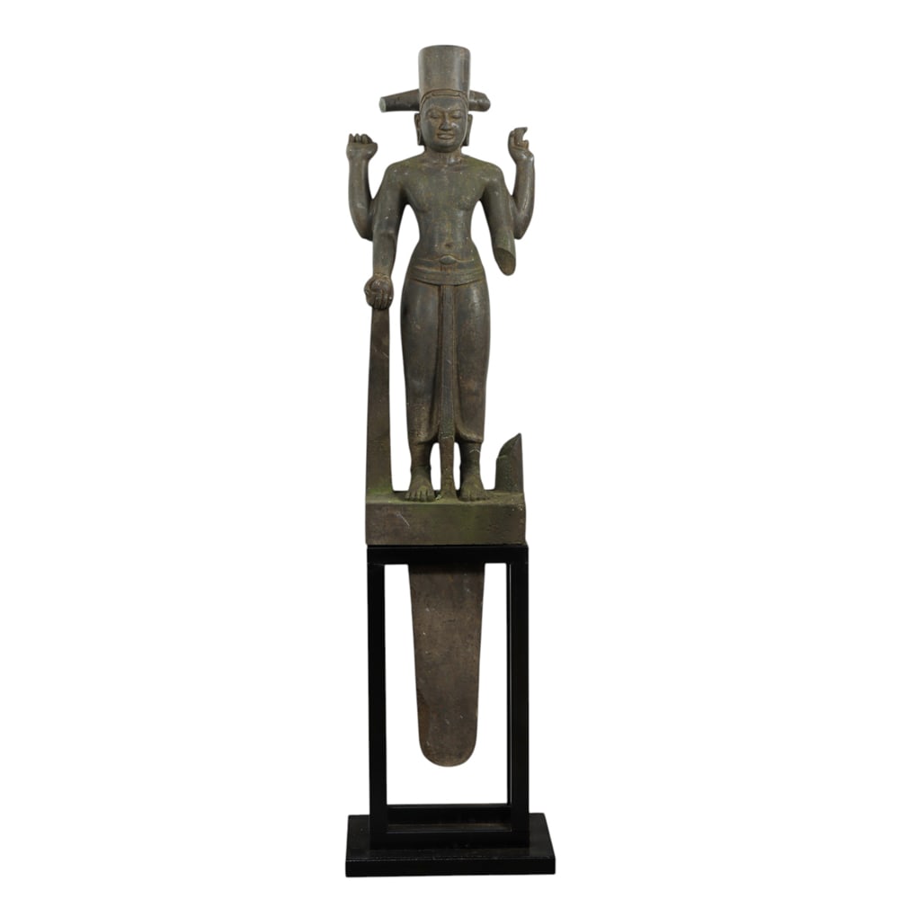 A Pre Angkor style stone Hindu figure on stand: A Pre Angkor style stone Hindu figure on stand. 66" high including stand. Provenance: purchased in Cambodia, July 2021