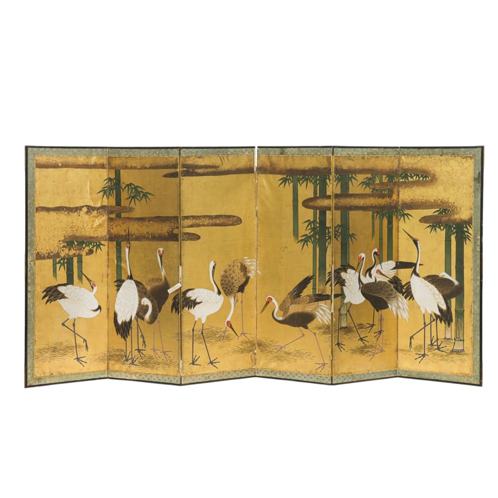 A Japanese six-panel 'crane' folding screen: A Japanese six-panel 'crane' folding screen. Ink and color on gold leaf paper, depicting cranes and bamboo motif, 66.5"h x 145"w.