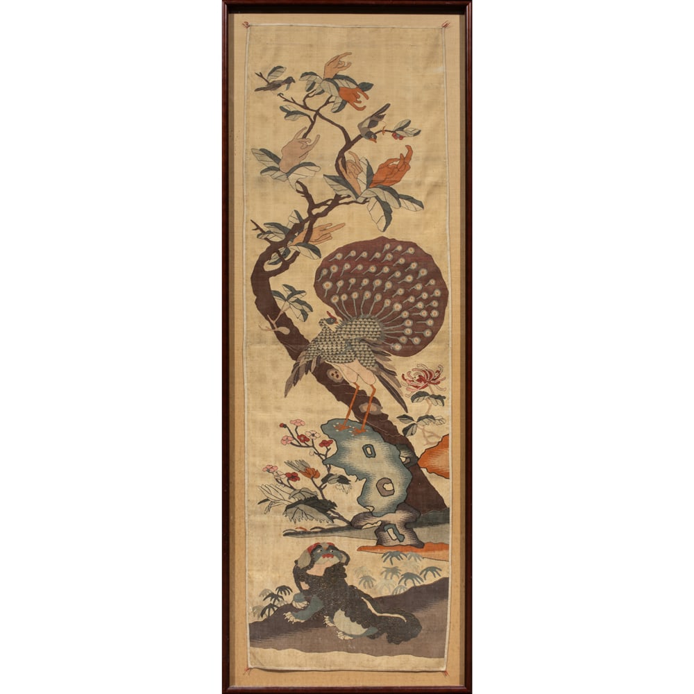 A Chinese kesi woven panel: A Chinese kesi woven panel. Depicting a peacock standing atop a scholar's rock beneath a Buddha's hand tree, with a pair of magpies perched among the branches, framed and glazed, late 19th century,