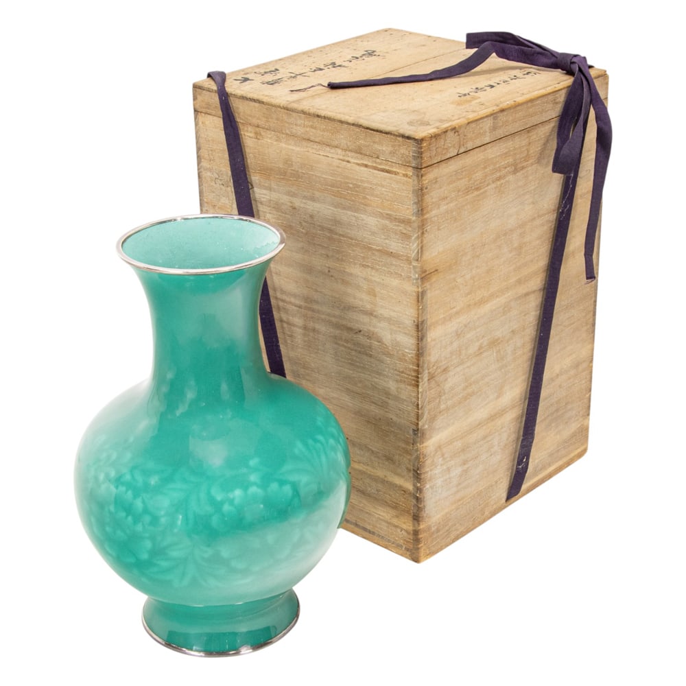 A Japanese enameled vase by Ando Jubei Studio: A Japanese enameled vase by Ando Jubei Studio. Of turnip form, covered overall in a bright emerald green enamel and decorated in shizumi enamel with a band of floral scroll to the bulbous body, with