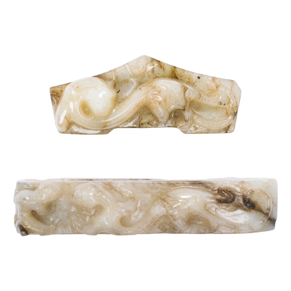 (lot of 2) Chinese archaistic jade carvings: (lot of 2) Chinese archaistic jade carvings. Featuring chilong motif, from 3" to 4" across.