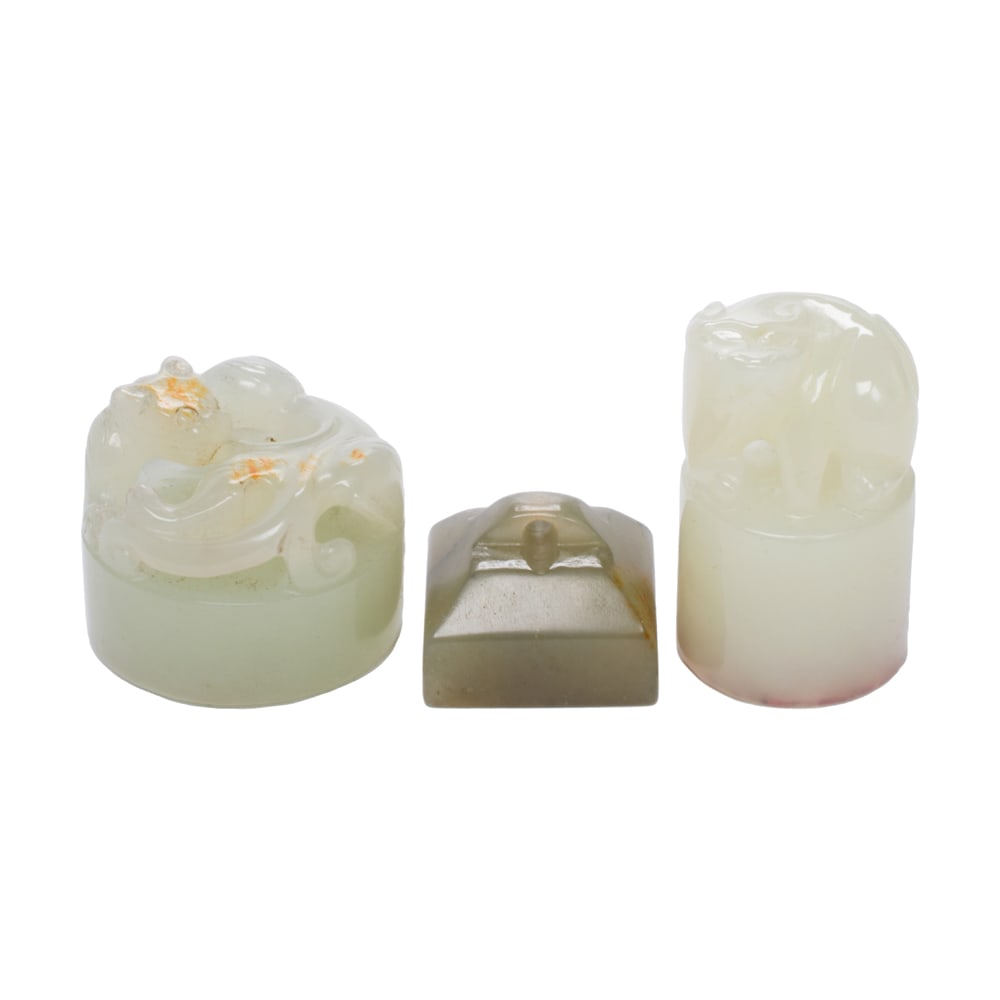 (lot of 2) Chinese jade seals: (lot of 2) Chinese jade seals. Featuring animal motif, from 0.75" to 1.125" across.