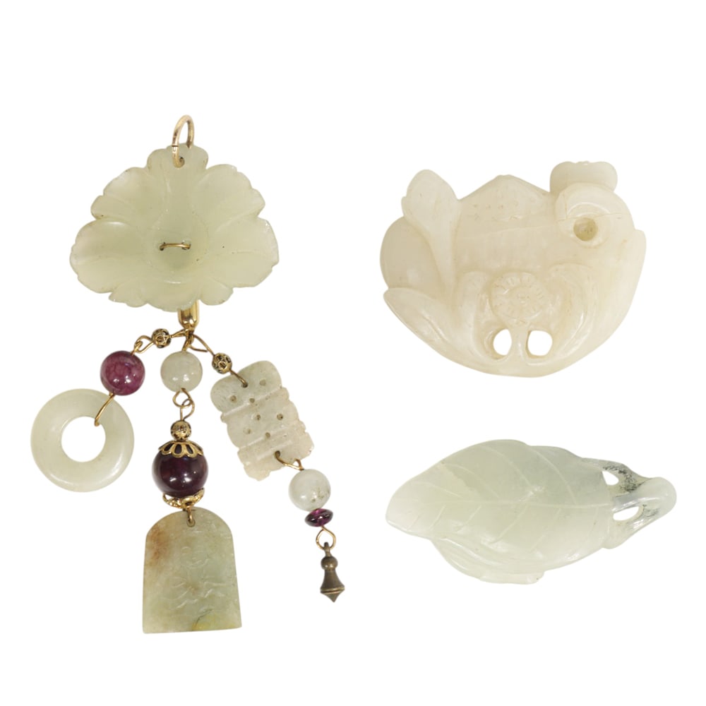 A group of Chinese white jade carvings: A group of Chinese white jade carvings. Featuring floral motif, 20th century, 2" widest.