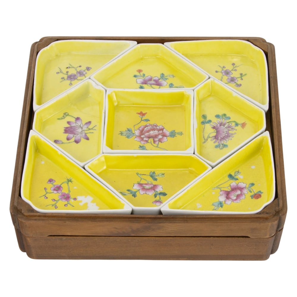A set of Chinese yellow ground famille rose trays with hardwood box