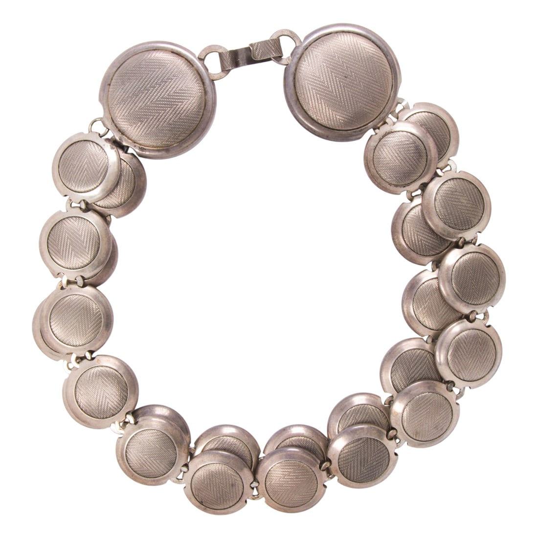 A British sterling silver necklace: A British sterling silver necklace Featuring two strands of machine-etched discs measuring 25.20 mm across; length: 16 1/2 in; 150.25 grams