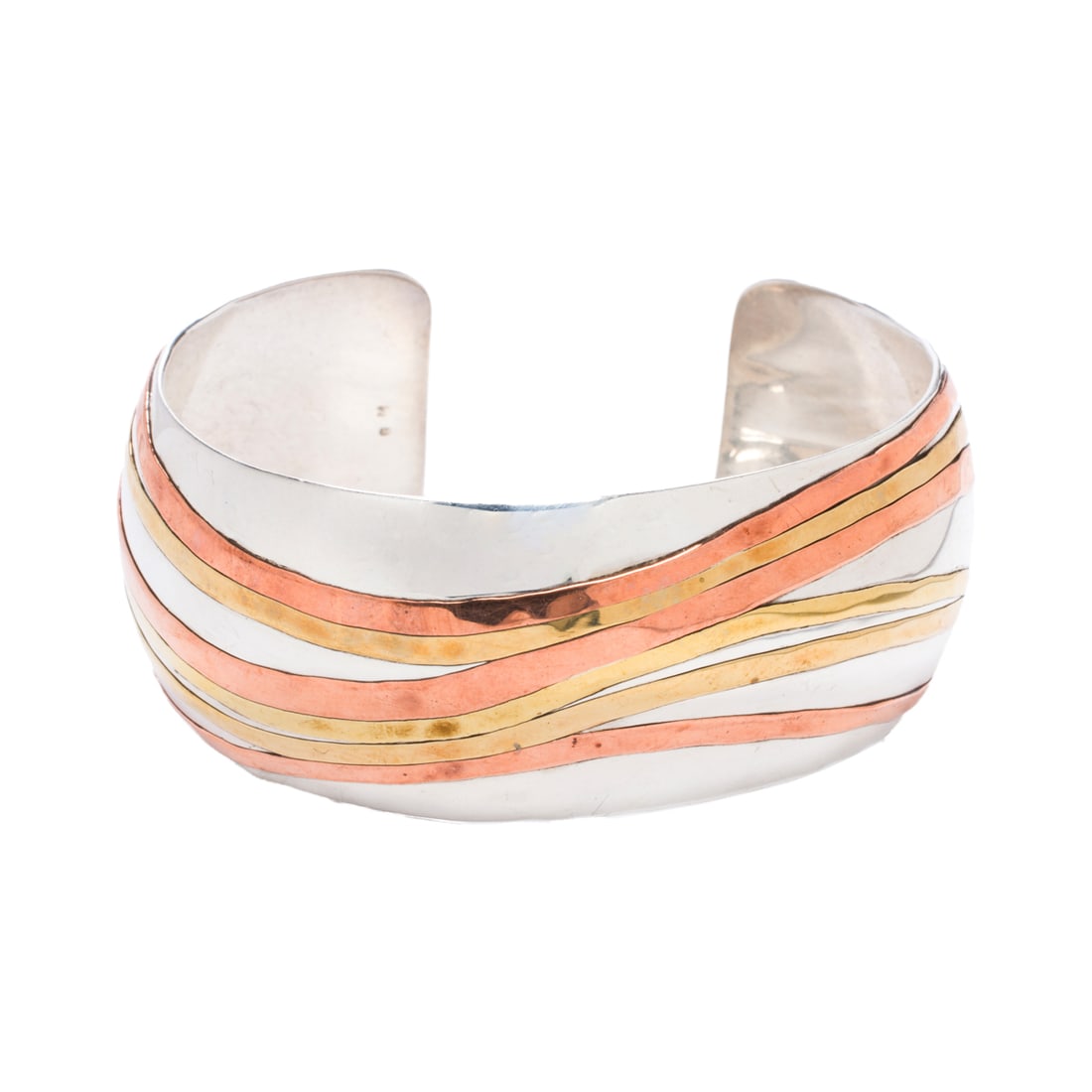 A silver cuff: A silver cuff Of abstract design; length: 6 1/4 in; 34.65 grams