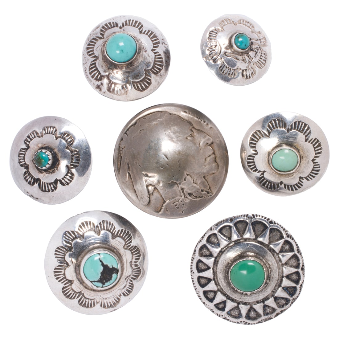 A group of Native American turquoise and silver buttons: A group of Native American turquoise and silver buttons Comprising seven silver buttons of Native American design set with round-shaped turquoise cabochons; gross weight: 12.65 grams