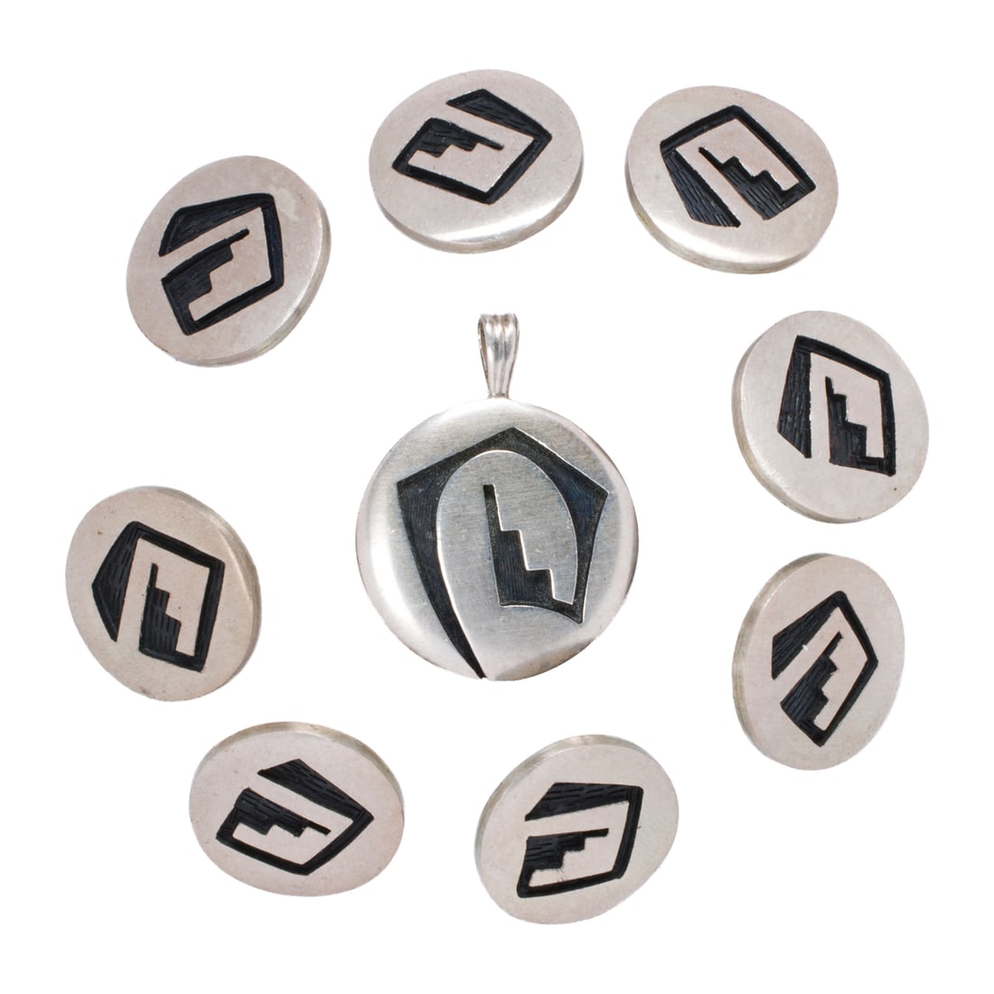 A group of turquoise and silver buttons: A group of turquoise and silver buttons comprising 5 buttons of varied size and design; lengths: 1/4 - 3/4 in; 12.70 gross grams