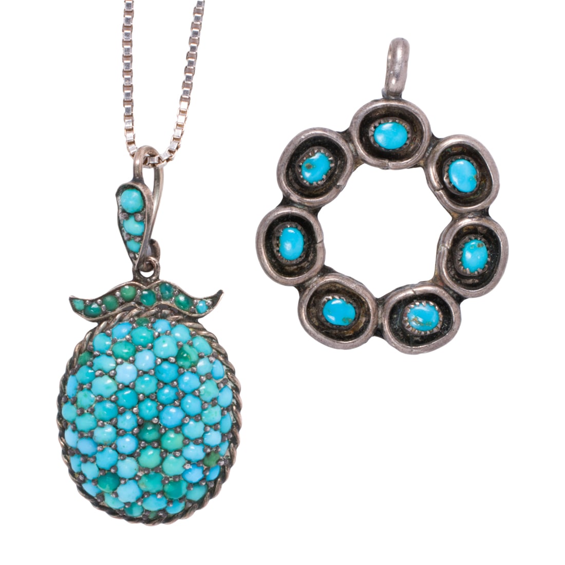 A turquoise and silver pendant and pendant necklace: A turquoise and silver pendant and pendant necklace Each featuring round and oval-shaped turquoise cabochons set in silver; gross weight: 8.80 grams