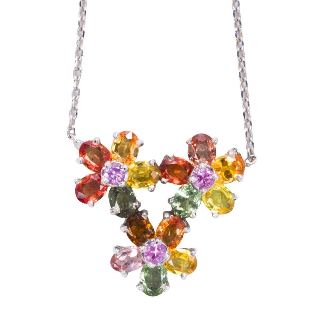 A multi-color sapphire and 14k white gold pendant necklace: A multi-color sapphire and 14k white gold pendant necklace of floral design featuring oval and circular-cut sapphires weighing approximately 3.25 carats in total; pendant length: 3/4 in; chain length: