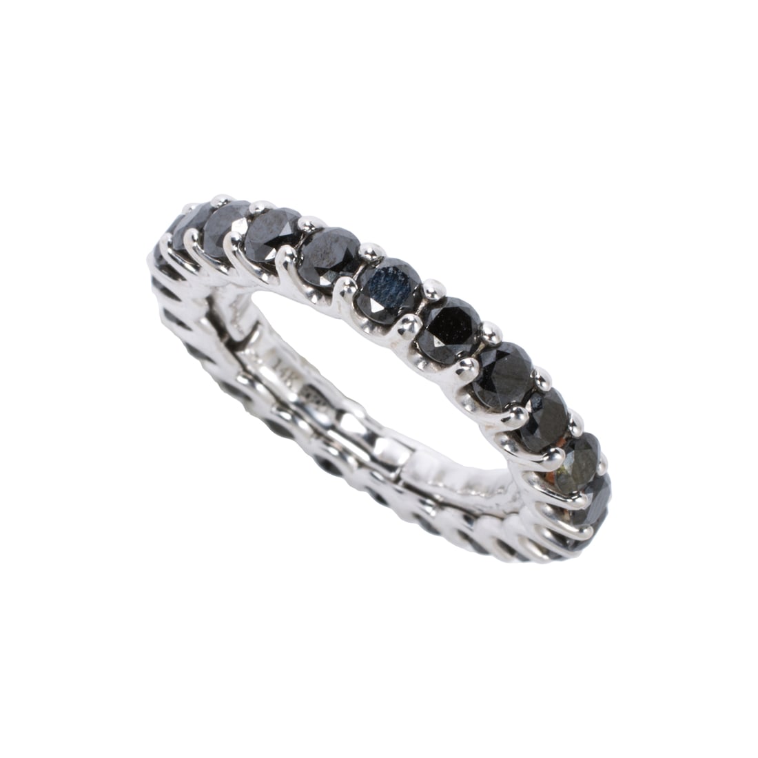 A black diamond and 14k white gold eternity band: A black diamond and 14k white gold eternity band Set with 24 round-cut black diamonds; size 7; 4.55 grams