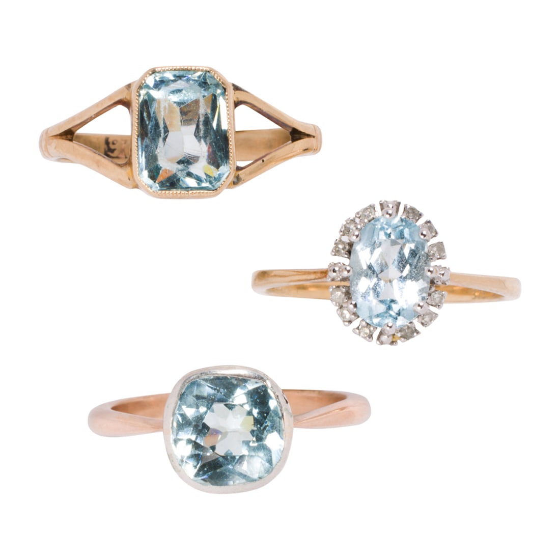 Three 10k gold rings The rings set with oval, emerald, and cushion cut blue stones set in 10k gold; (1 of 2)