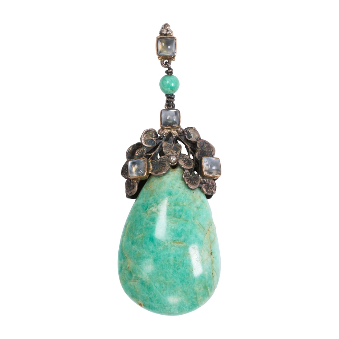 A blue hardstone and moonstone pendant: A blue hardstone and moonstone pendant Featuring a drop shaped blue hardstone bead measuring 2 x 1 in, with foliate surmount set with four sugarloaf moonstone cabochons; length: 3 1/4 in; 32.85 grams