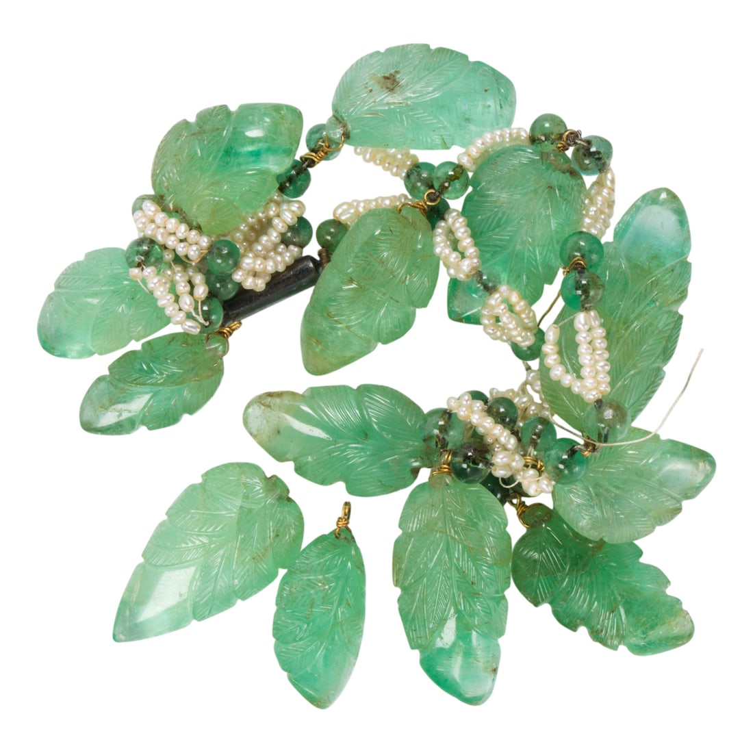 A group of carved tourmaline beads and seed pearls: A group of carved tourmaline beads and seed pearls Featuring carved tourmaline feathers; gross weight: 62.20 grams