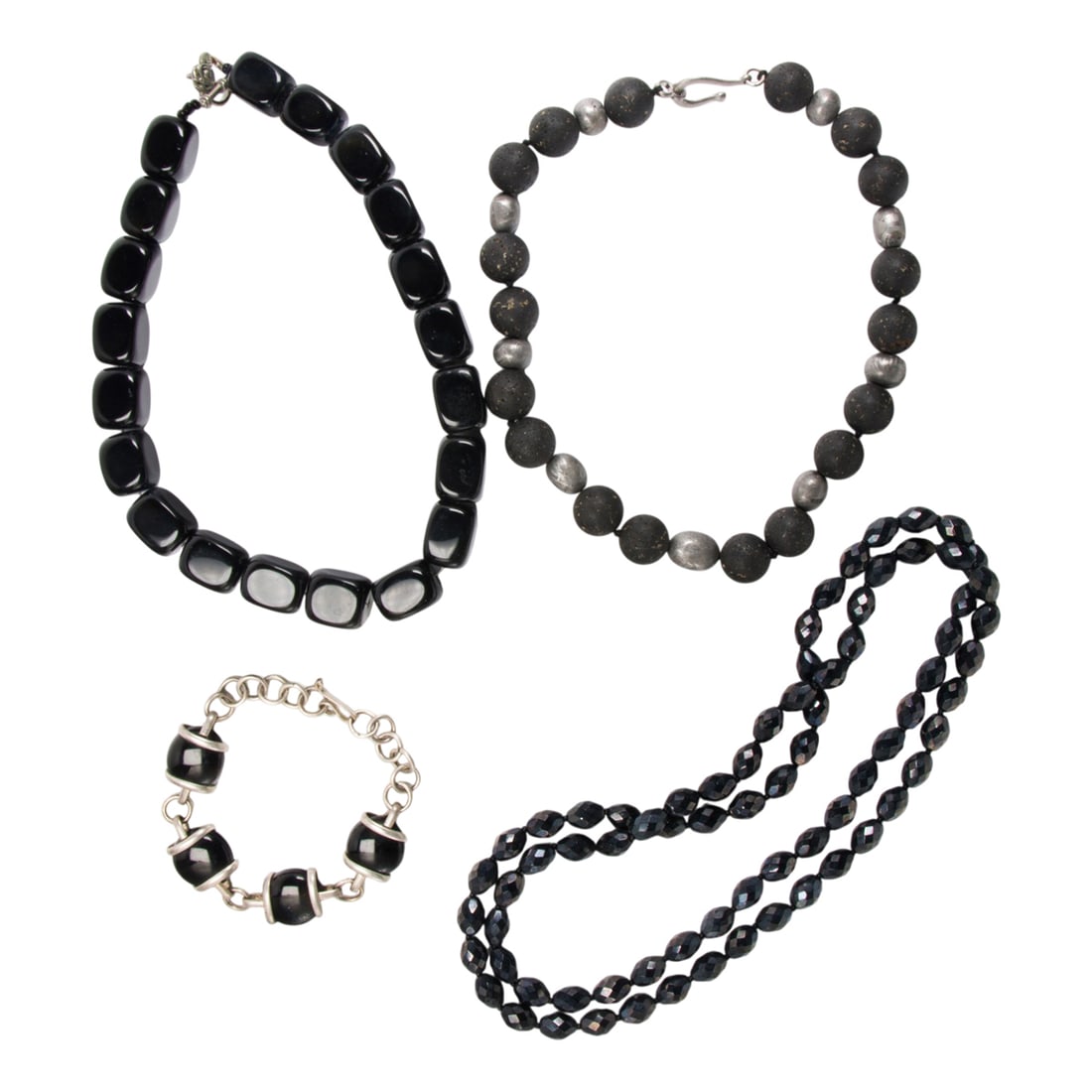 A group of mostly onyx jewelry: A group of mostly onyx jewelry comprising a black stone and metal necklace, two onyx necklaces and a onyx bracelet; 470.00 gross grams