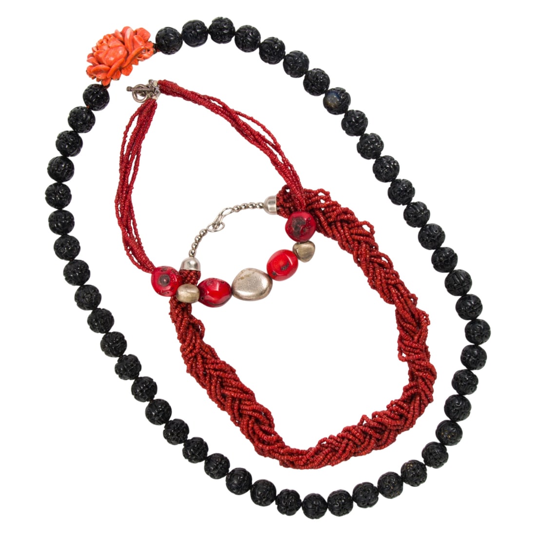 A group of coral necklaces: A group of coral necklaces comprising three necklaces featuring carved wood coral and base metal; lengths: 14, 18 and 32 in