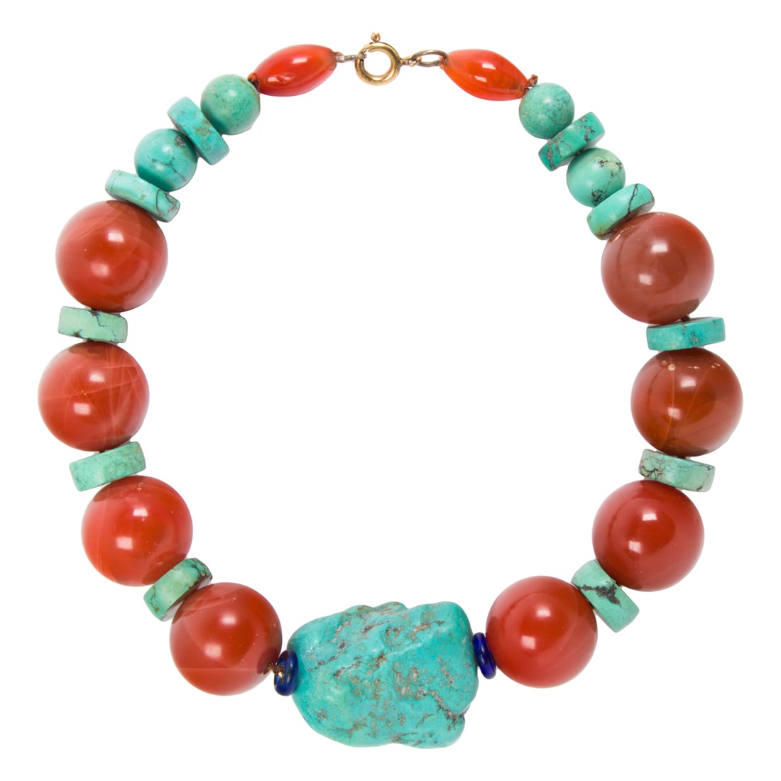 A turquoise and carnelian necklace: A turquoise and carnelian necklace centering a large rough turquoise, accented by large carnelian beads and turquoise disc; 257.00 grams; length: 16 in